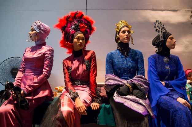 Models in designs by designer Calvin Thoo at the "Islamic Fashion Festival" in Kuala Lumpur, Malaysia image credit - Vincent Thian/Associated Press